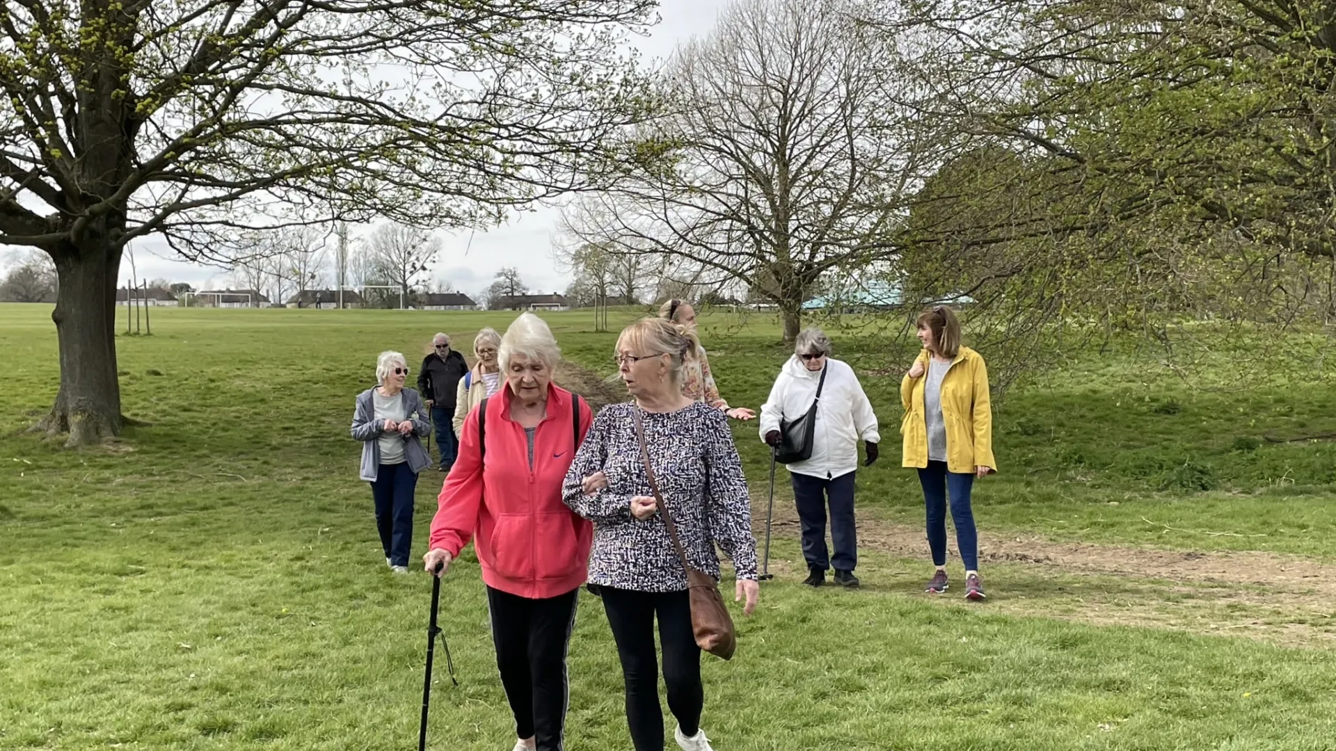 People walking through a park