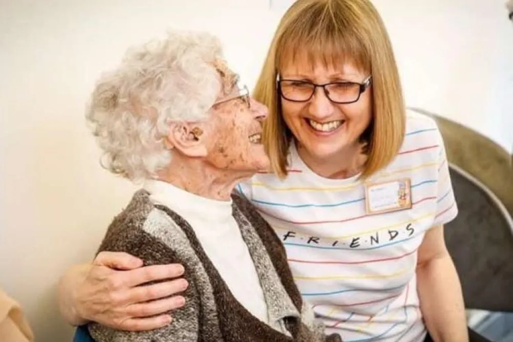 Two women hugging