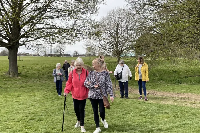People walking through a park