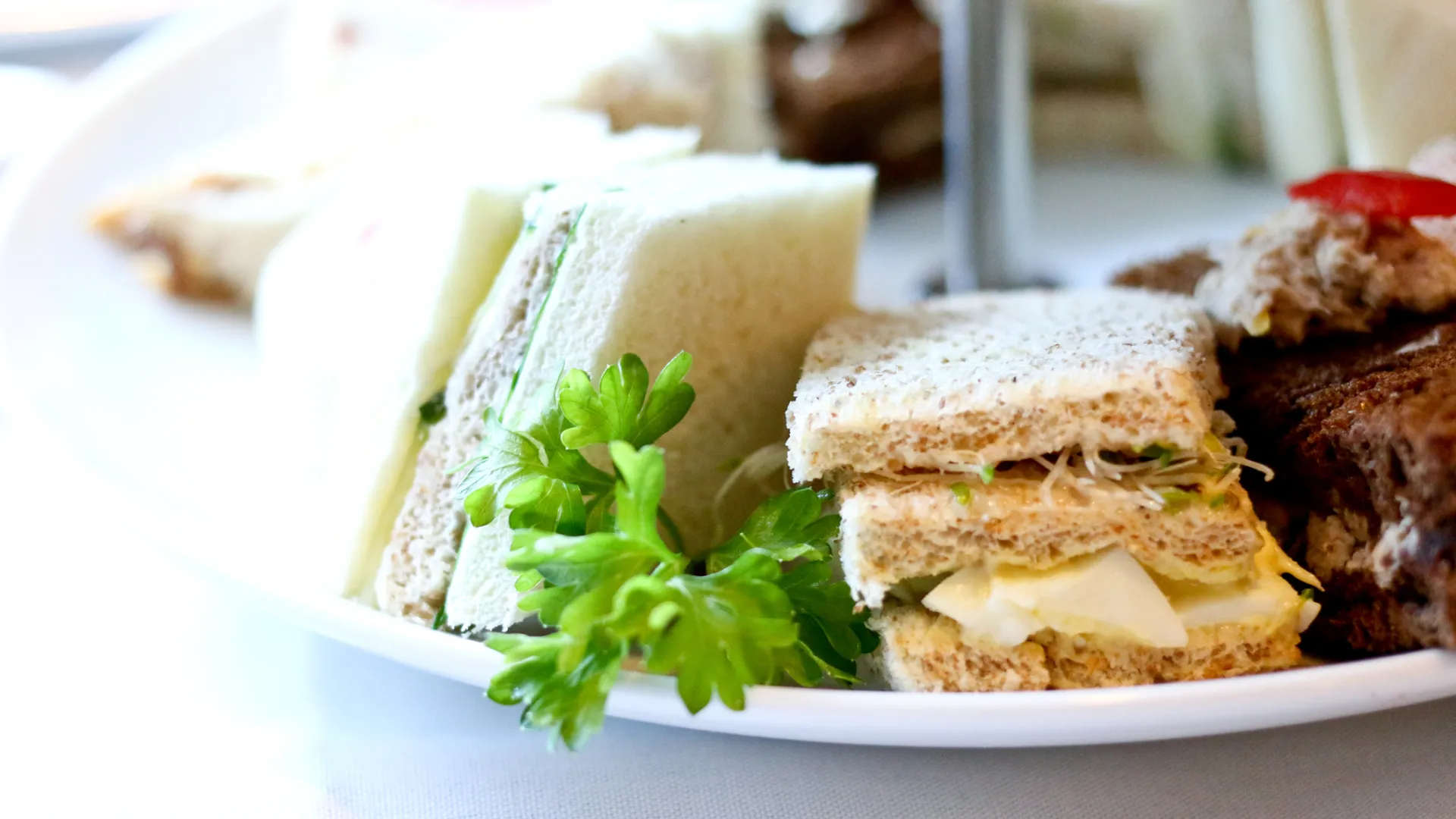 Selection of finger sandwiches and cake