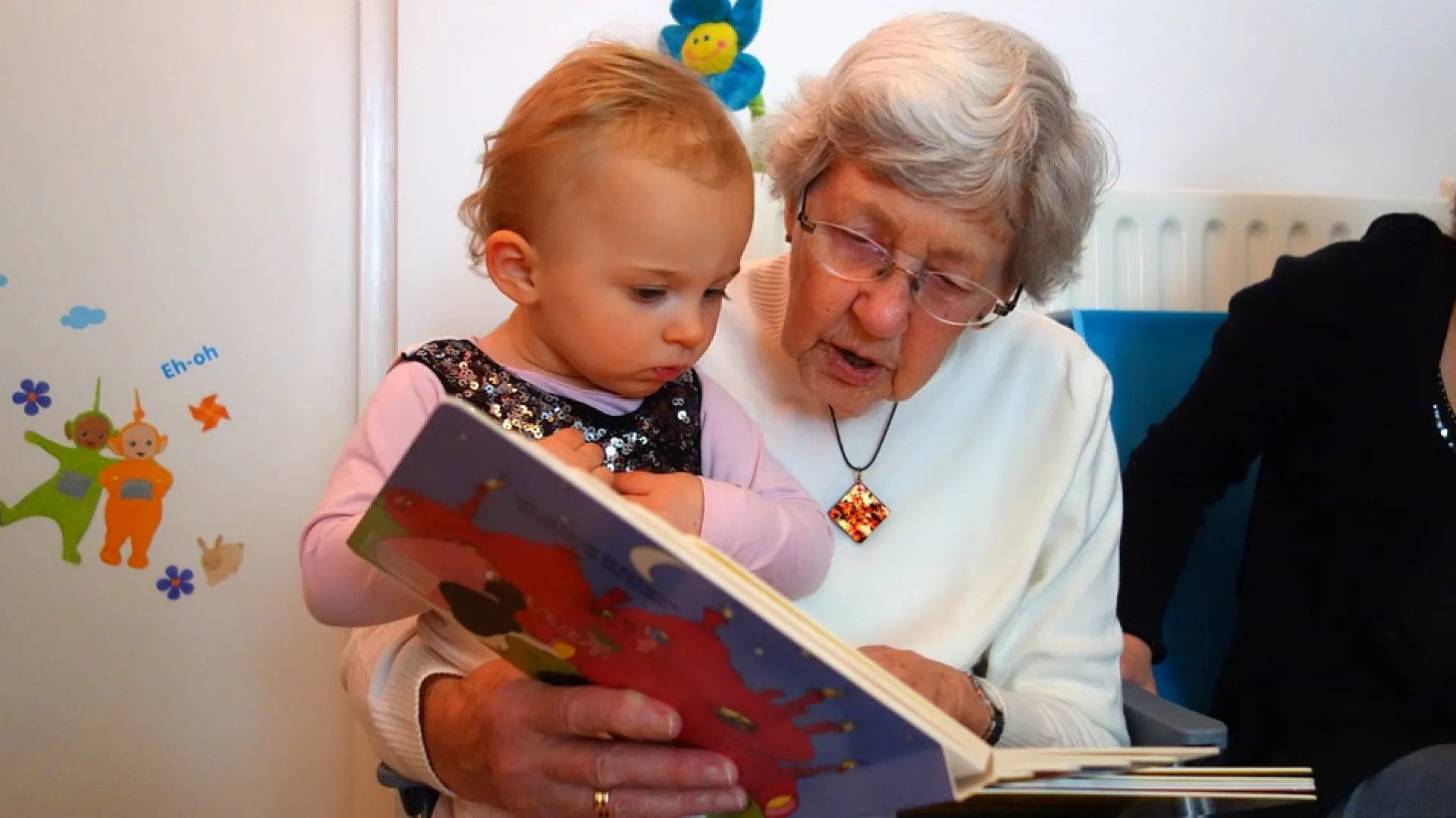 Grandma reading to child