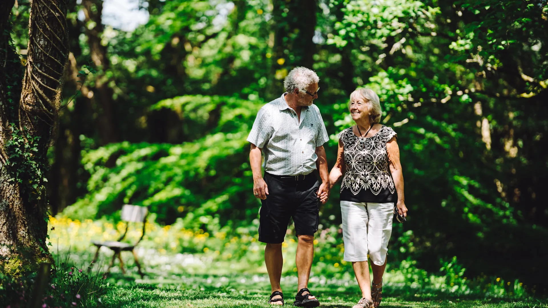 Couple walking through forest