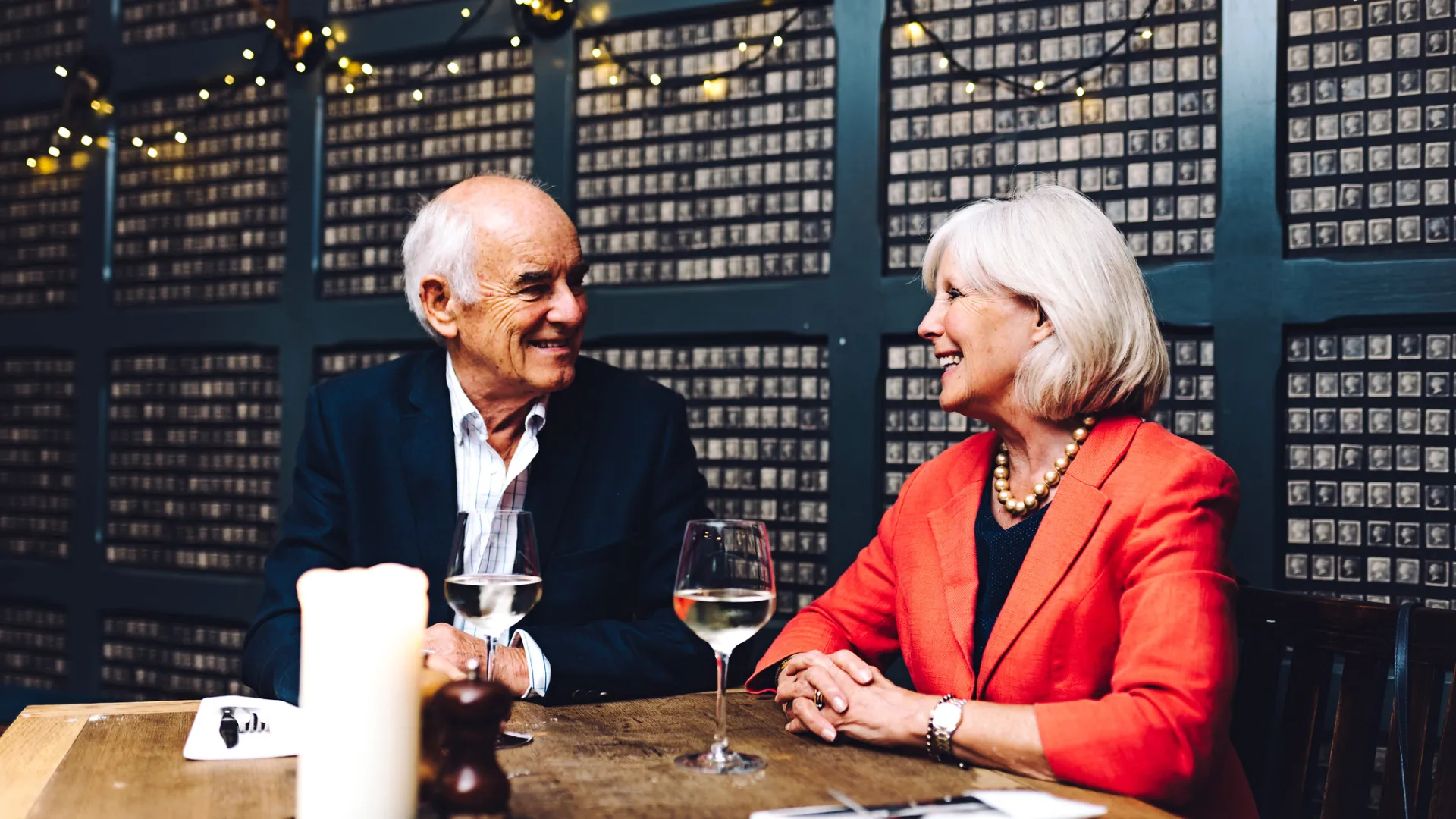 A couple out for dinner drinking wine