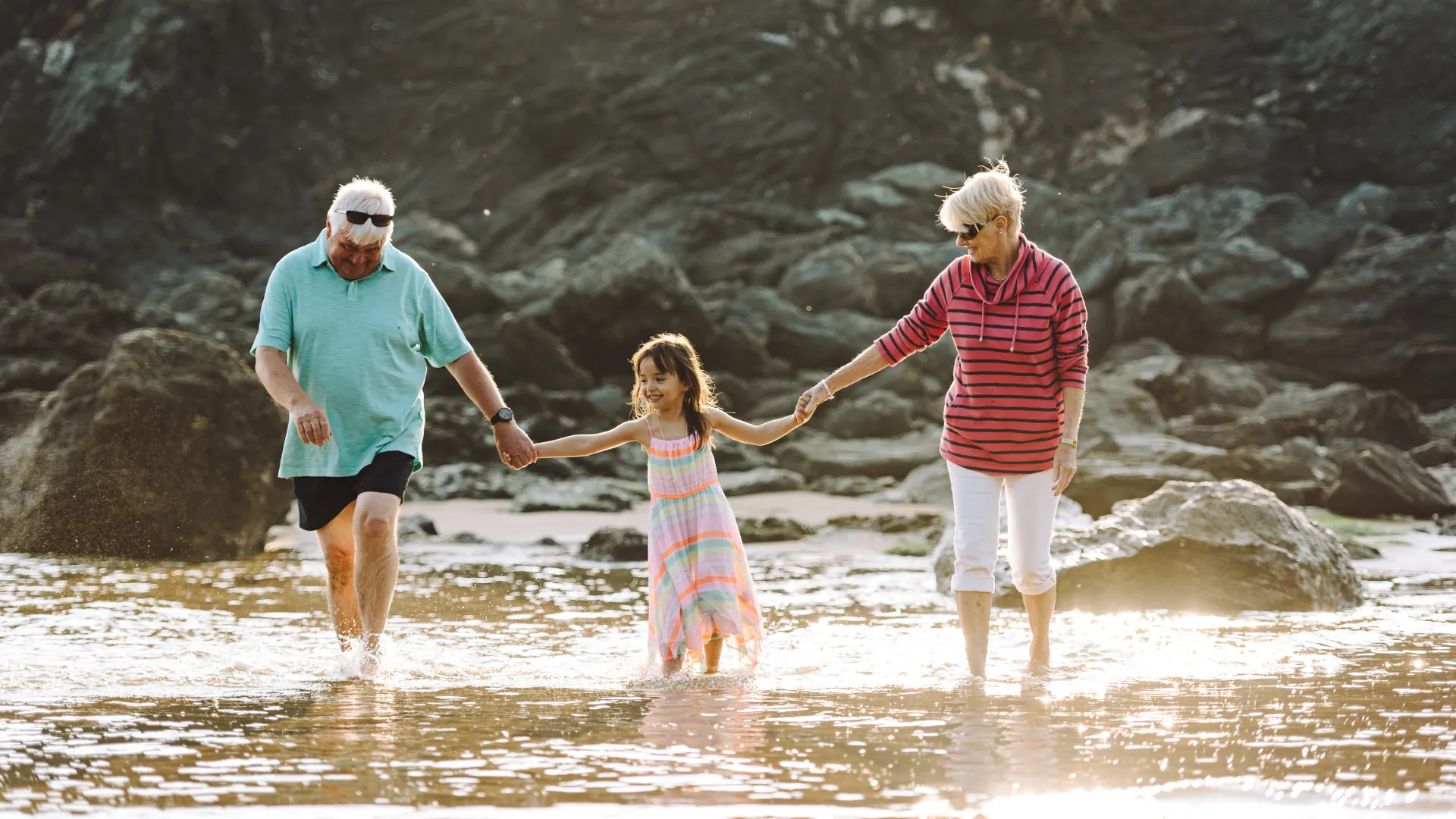 Grandparents with their grandchildren at the beach