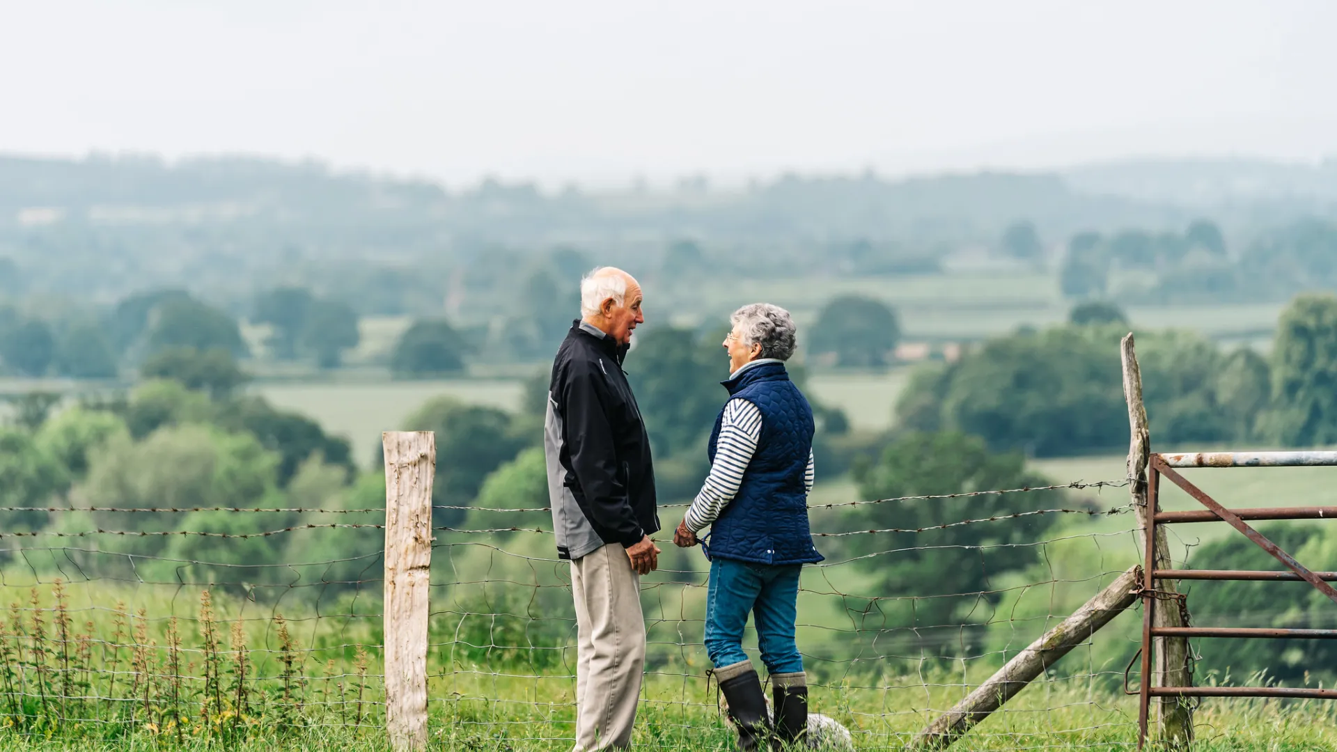 A couple standing in the countryside