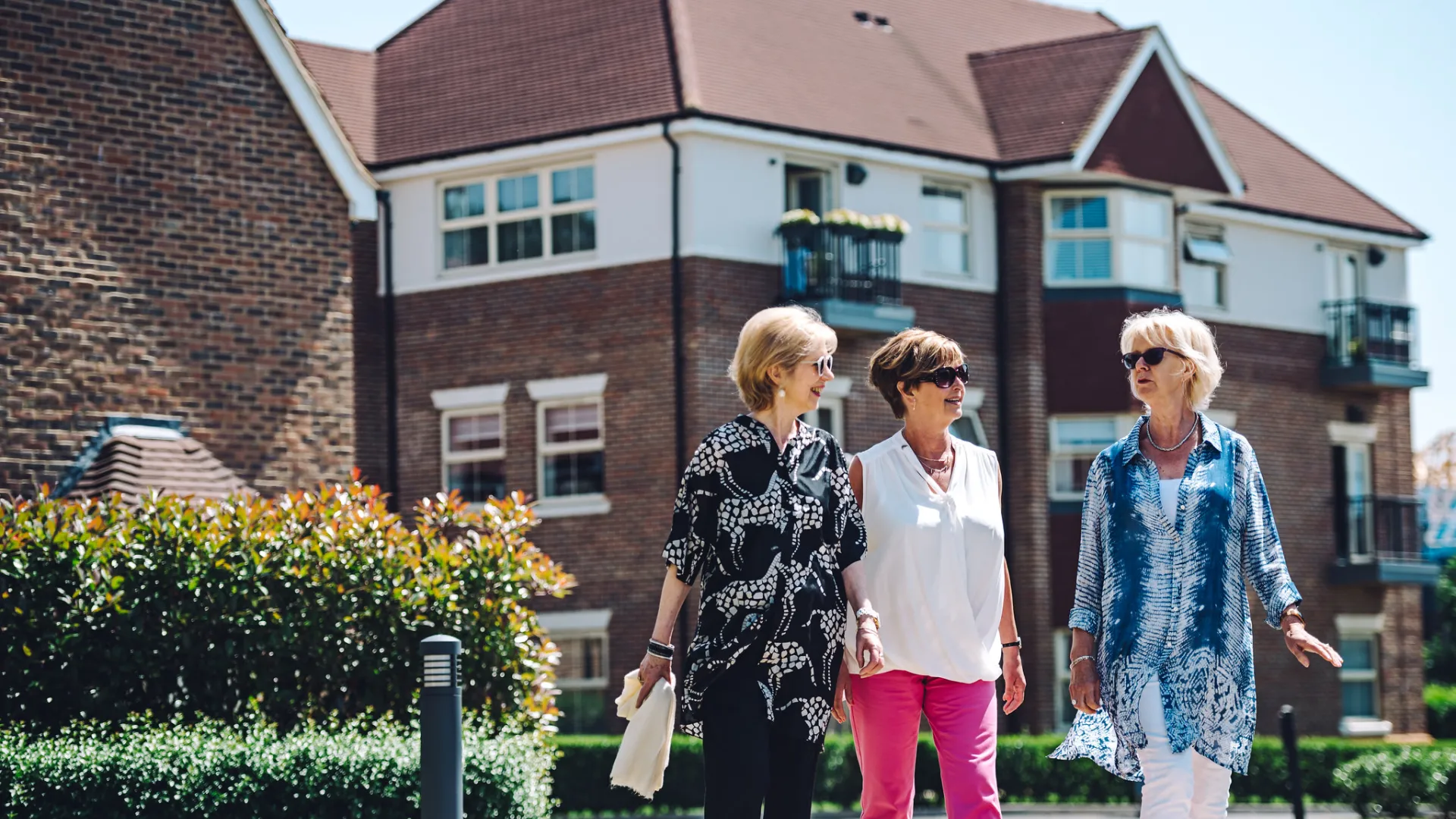 Three women walking round an Inspired Village