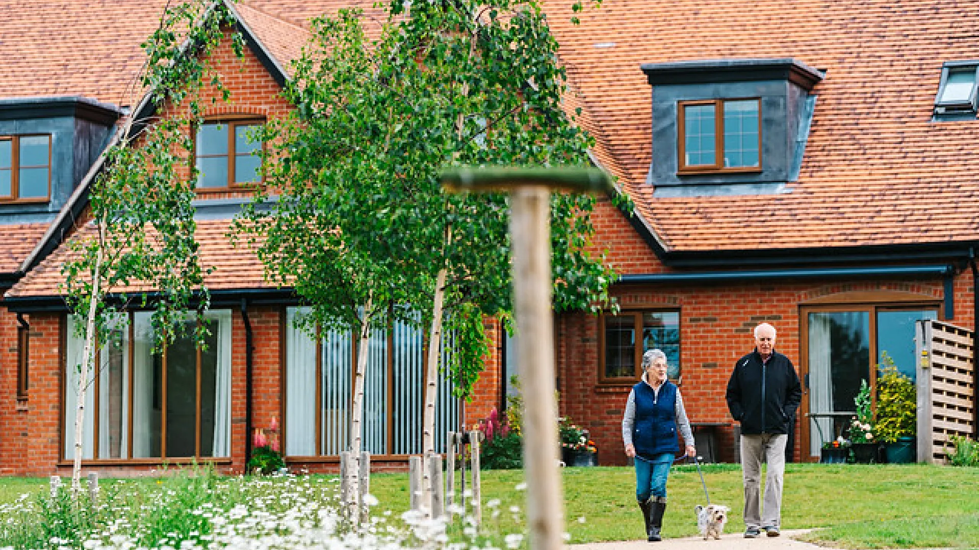 Two people walking through a Inspired retirement village