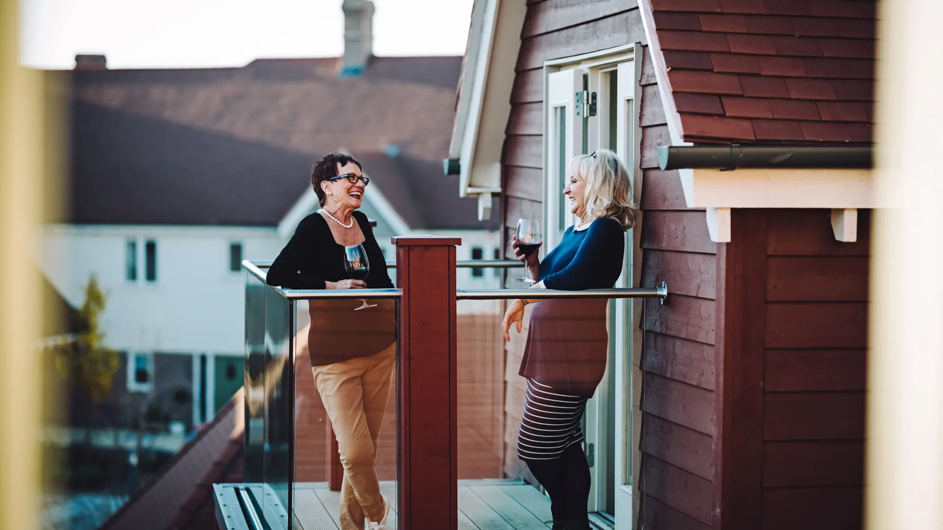 Two people stood on a balcony