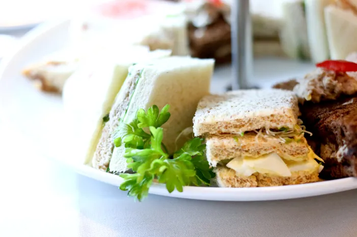 Selection of finger sandwiches and cake