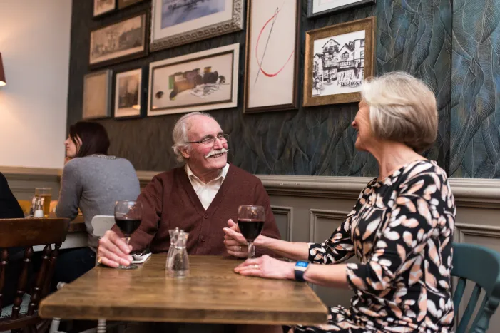 Man and women having a meal