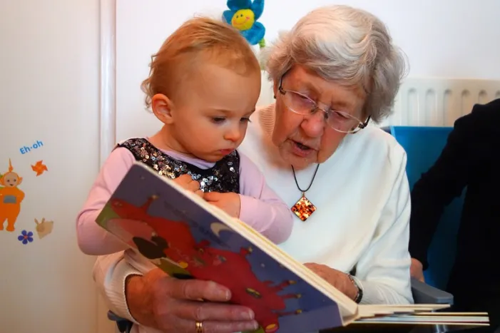 Grandma reading to child