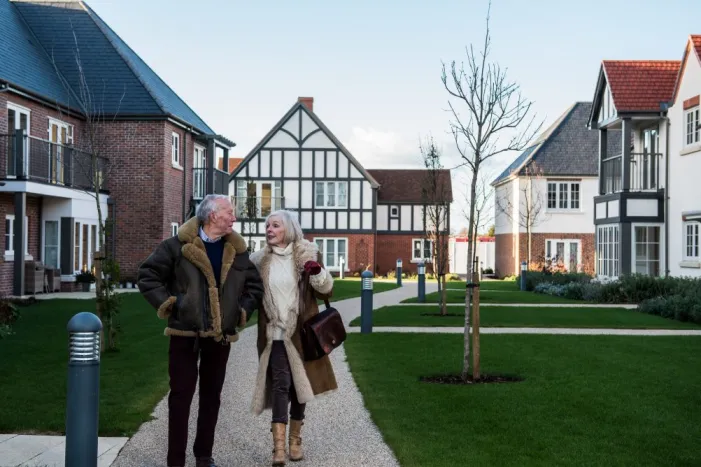 A couple walking around an Inspired retirement village