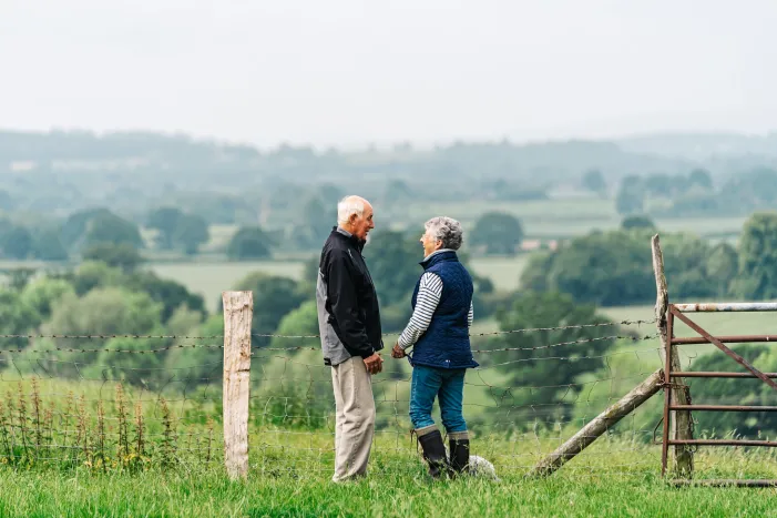 A couple standing in the countryside