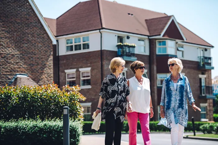 Three women walking round an Inspired Village