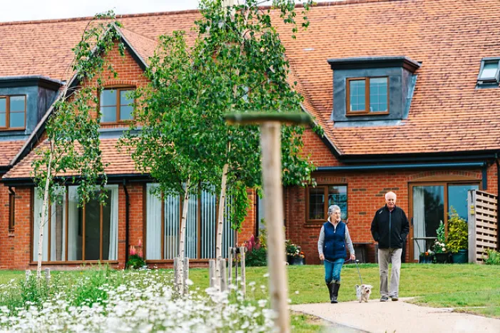 Two people walking through a Inspired retirement village